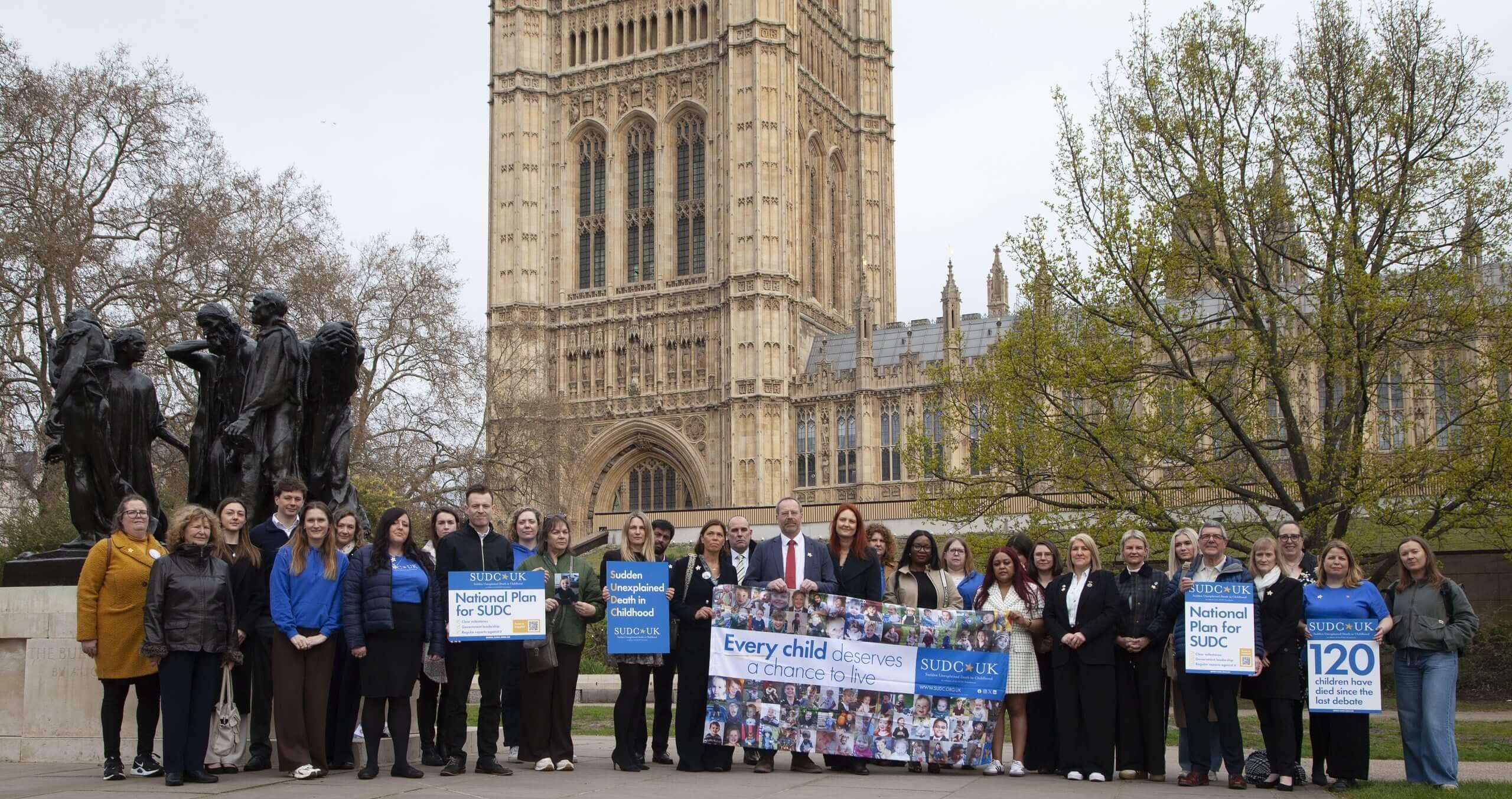 Image of Houses of Parliament with SUDC "lets shine a light on SUDC" logo